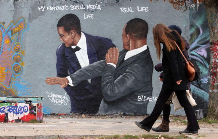Graffiti depicting a meme showing actor Will Smith slapping comedian Chris Rock