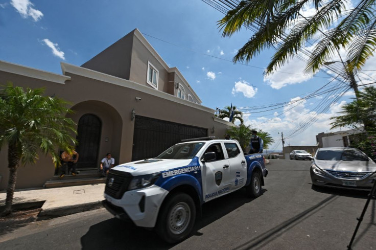A National Police truck stands guard outside Honduran former President Juan Orlando Hernandez's 