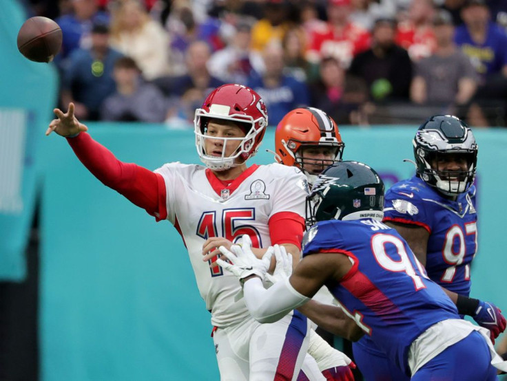 Patrick Mahomes #15 of the Kansas City Chiefs and AFC throws the ball under pressure from Josh Sweat #94 of the Philadelphia Eagles