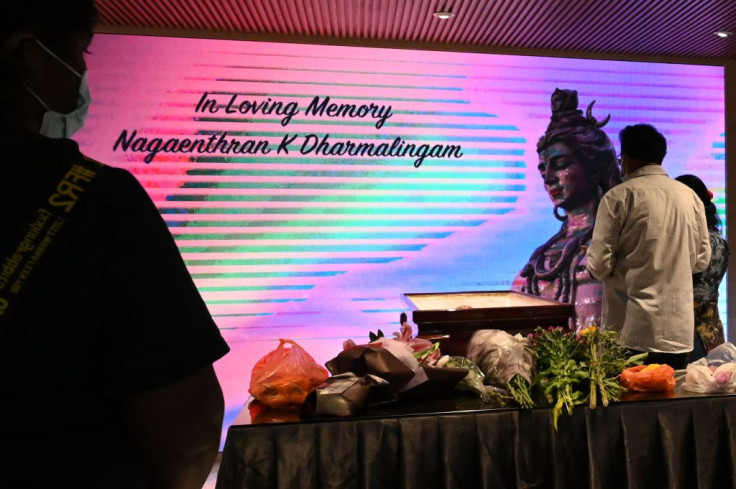 People pay tribute at a wake for Malaysian national Nagaenthran K. Dharmalingam