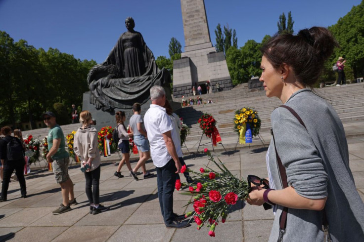Visitors arrive at the Soviet War Memorial to commemorate Victory Day