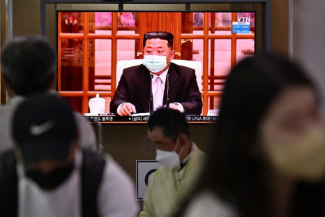North Koreas leader Kim Jong Un appearing in a face mask on television