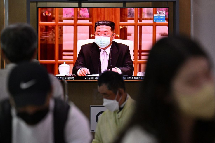 North Koreas leader Kim Jong Un appearing in a face mask on television