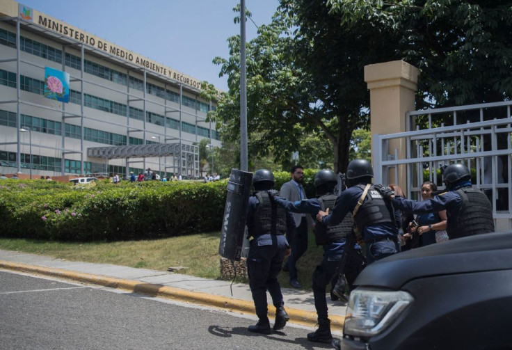 Police are deployed at the Dominican Ministry of Environment headquarters