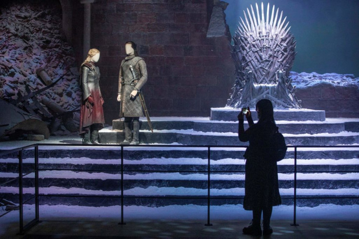 A visitor takes pictures of a 'Game of Thrones' set