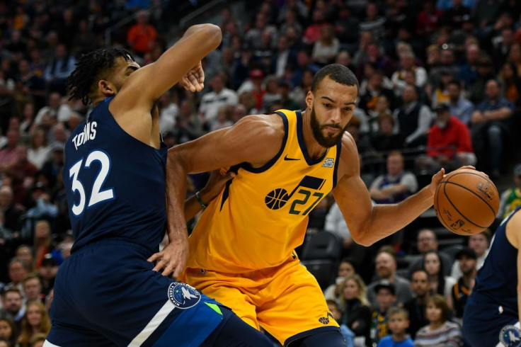 Rudy Gobert #27 of the Utah Jazz attempts to drive around Karl-Anthony Towns #32 of the Minnesota Timberwolves