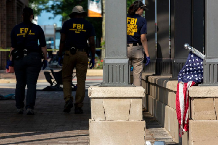 FBI agents work the scene of a shooting at a Fourth of July parade on July 5, 2022 in Highland Park, Illinois