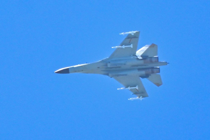 A Chinese military jet flies over Pingtan island