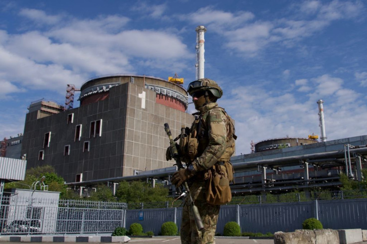 A Russian serviceman patrols the territory of the Zaporizhzhia Nuclear Power Station in Energodar