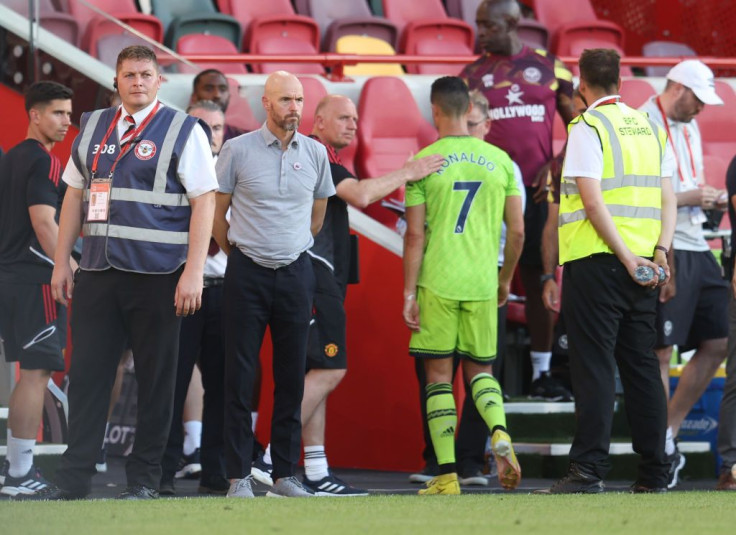 Erik ten Hag manager of Manchester United looks on as Cristiano Ronaldo walks past him