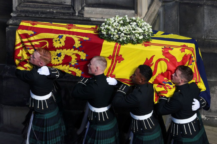 Pallbearers carry the coffin of Britain's Queen Elizabeth II as the hearse arrives at St. Giles' Cathedral