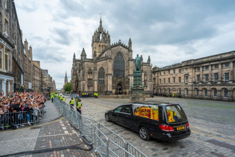 The hearse carrying the coffin of Queen Elizabeth II passes St Giles' Cathedral in Edinburgh