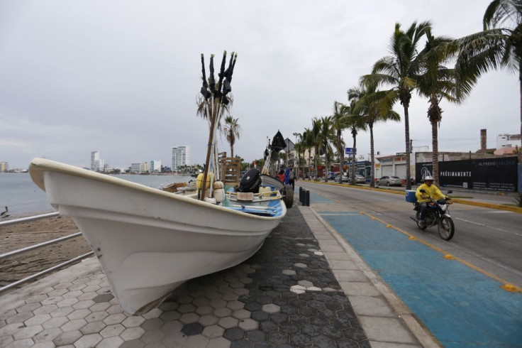 Picture of a boat removed from the sea and placed on the sidewalk ahead of the arrival of Hurricane Orlene