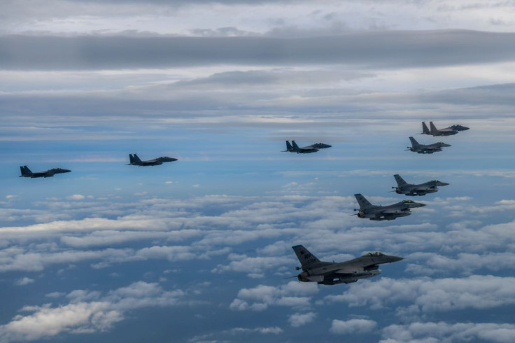 South Korean Air Force F-15Ks and U.S. Air Force F-16 fighter jets fly over the Korean Peninsula