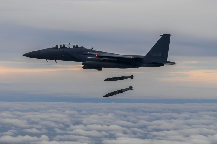 A South Korean F-15K fighter fires two Joint Direct Attack Munition bombs