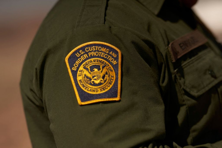 A US Customs and Border Protection patch is seen on the arm of an agent in the Jacumba mountains