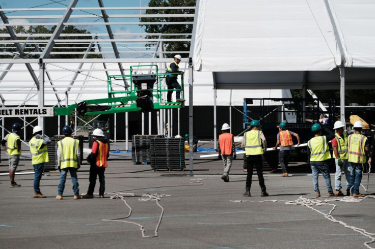 Large tents are constructed in a parking lot at Orchard Beach in the Bronx 