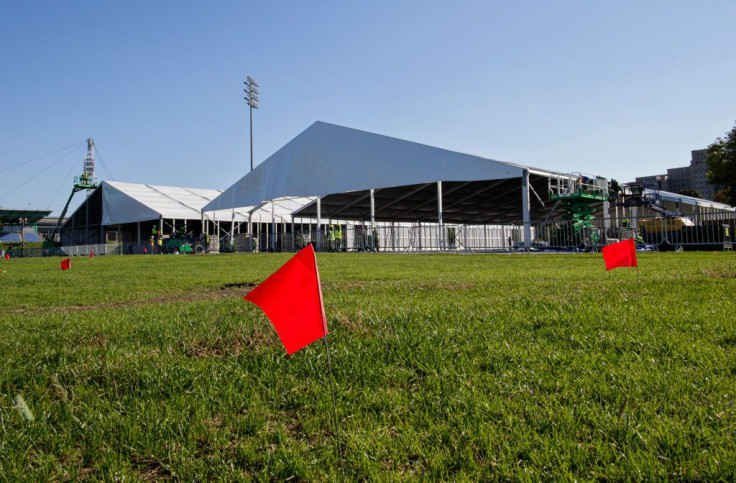 Workers assemble emergency tents to house asylum seekers on Randall's Island