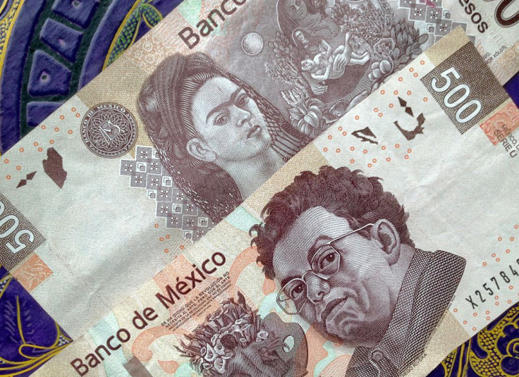 500 Mexican pesos notes on a table with traditional Mexican ornament. 