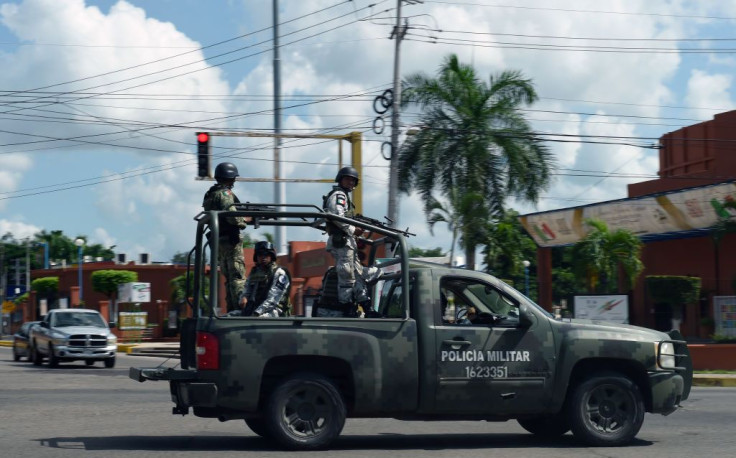 file picture of Members of the National Guard patrolling a street in Culiacan, Sinaloa state
