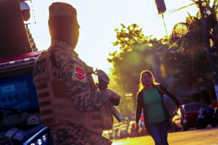 A soldier stands guard during the anti-gang operation in Soyapango