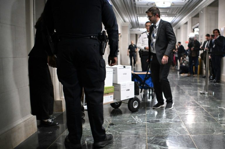 Documents being carted for a hearing by the House Ways and Means Committee to discuss Trump tax returns