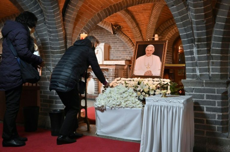 Catholic worshippers pay their respects to former Pope Benedict XVI 