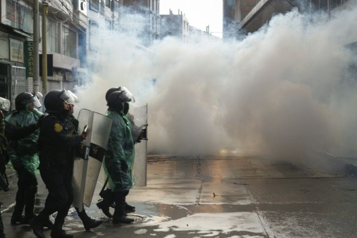 Riot police clash with anti-government protesters in Puno, Peru
