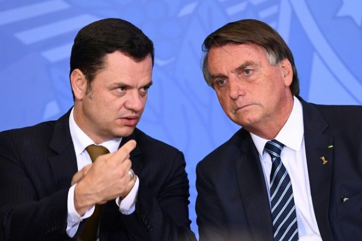 Anderson Torres (L) and Jair Bolsonaro