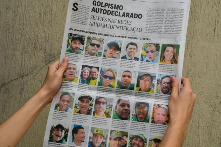 A page from the Brazilian newspaper O Globo featuring the faces of rioters who stormed key buildings in the capital Brasilia