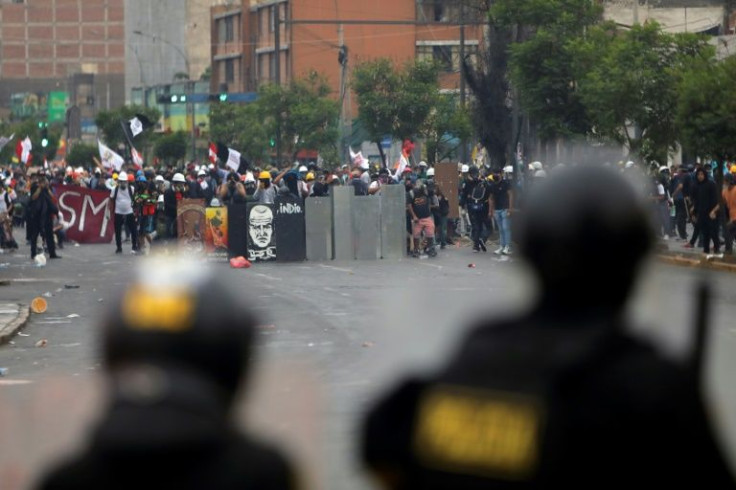 Demonstrators clash with riot police during a protest