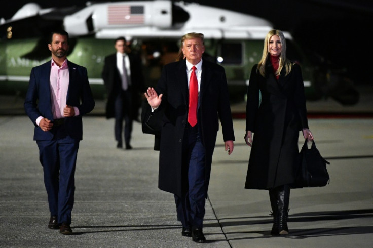 Donald Trump walks with daughter Ivanka and son Donald Jr.
