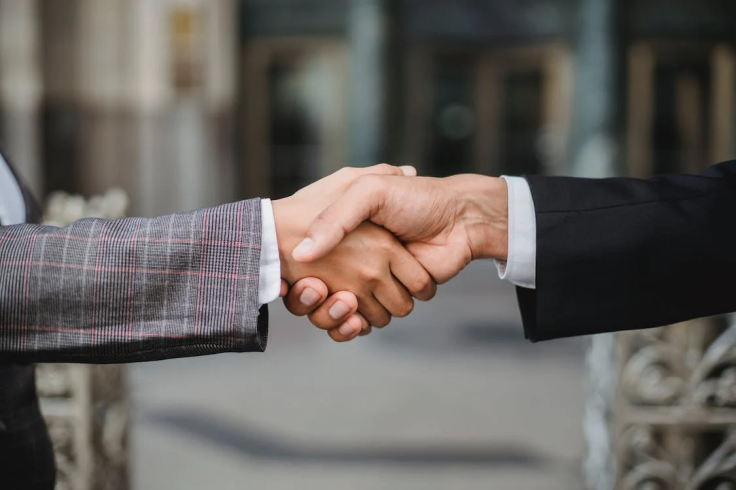 Two People Shaking Hands - Business