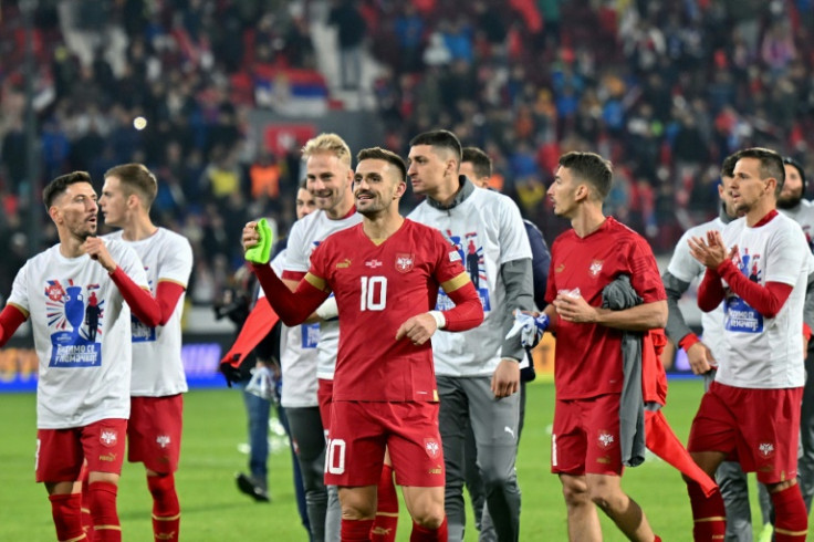 Serbia's players celebrate reaching the European Championship