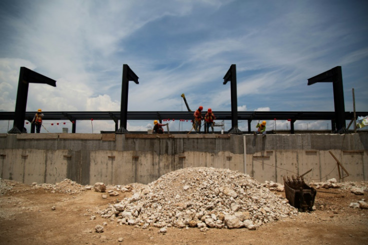 Workers build a rail stop for the Maya Train in Uman, Mexico in August 2023