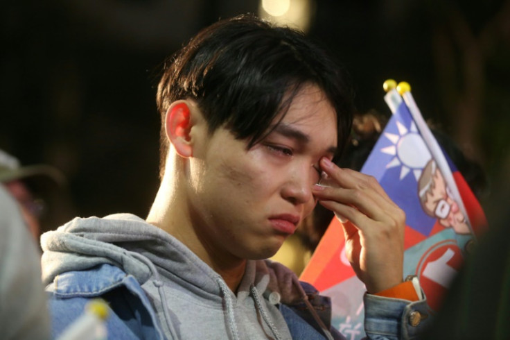 Supporters of Taiwan People's Party (TPP) presidential candidate Ko Wen-je react as they wait for results at the TPP headquarters in Xinzhuang, in New Taipei City, on January 13, 2024