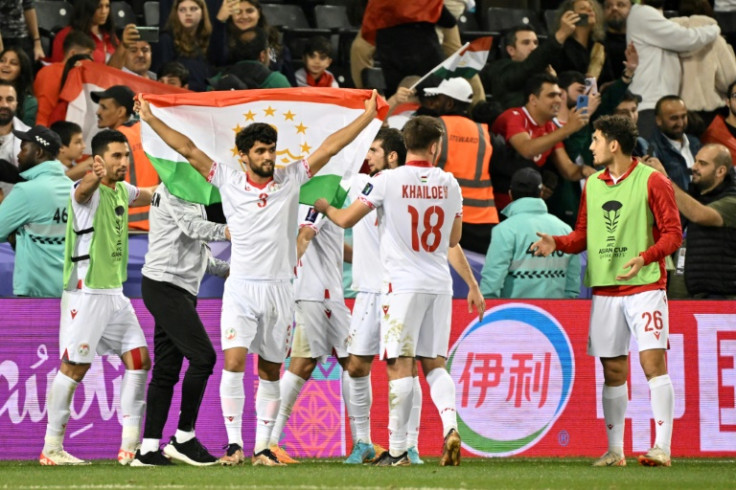 Tajikistan's players celebrate their win over Lebanon