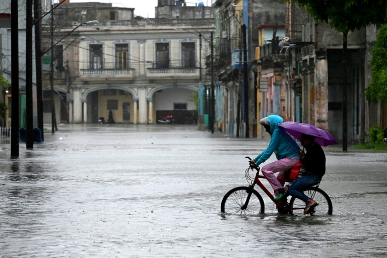 Buildings collapse and streets flood in Cuba as heavy rains pummel Havana