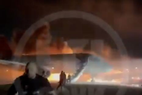 Passengers evacuating an Azimuth Airlines airplane as it caught fire