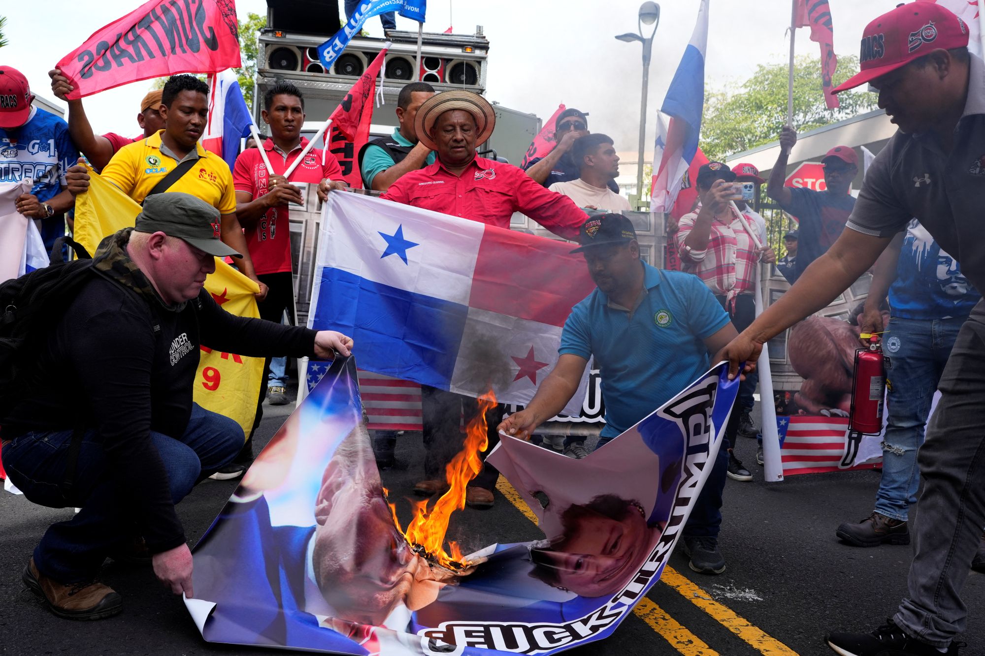 Protestors Burn US Flag Following Trump's Threats to Retake Control of ...