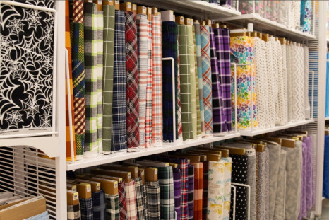 Fabrics are on display in a Joann store