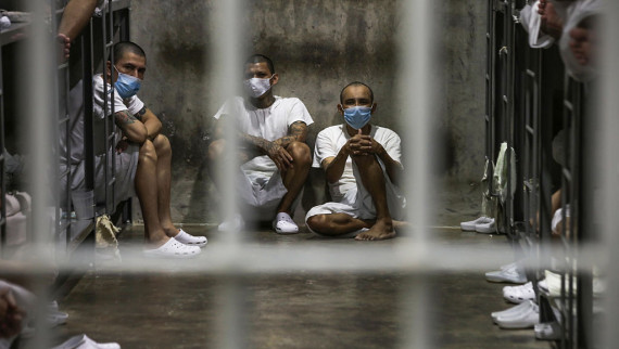 Prisoners look out of their cell at CECOT prison