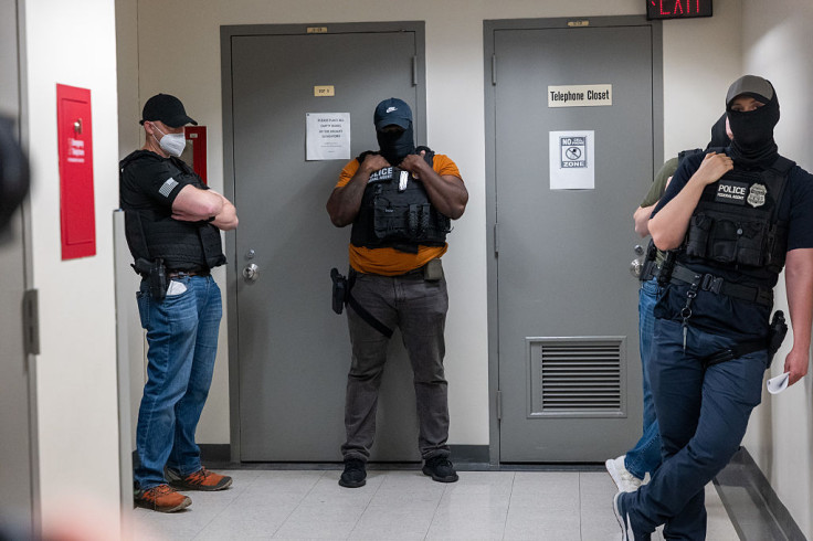 ICE agents waiting to arrest immigrants during mandatory check-ins