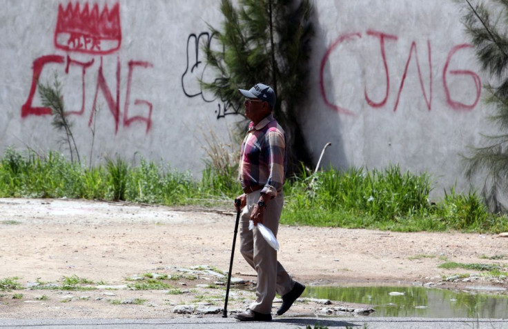 The initials of the CJNG painted on a Jalisco wall