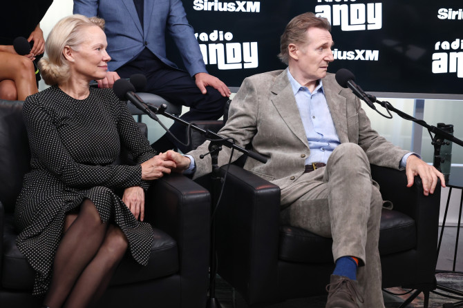Liam Neeson and Pamela ANderson hold hand sirius Naked Gun