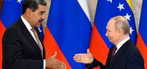Russia's Vladimir Putin and Venezuela's Nicolas Maduro shake hands