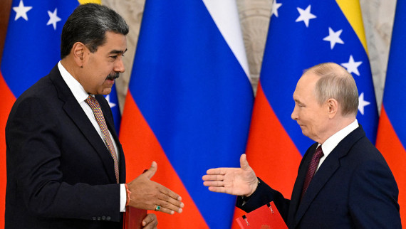 Russia's Vladimir Putin and Venezuela's Nicolas Maduro shake hands