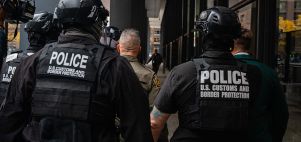 Border Patrol pushes through a crowd