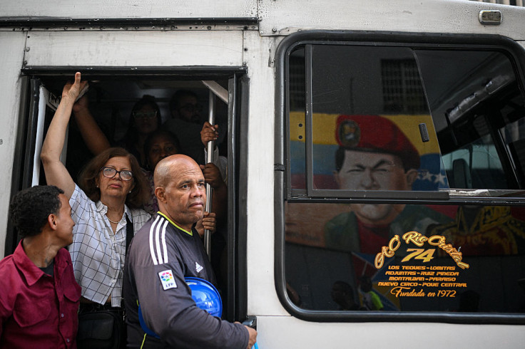 Bus with reflection of mural depicting late Venezuelan President Chavez