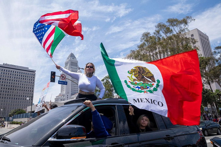 Demonstrators wave a combination US and Mexico flag